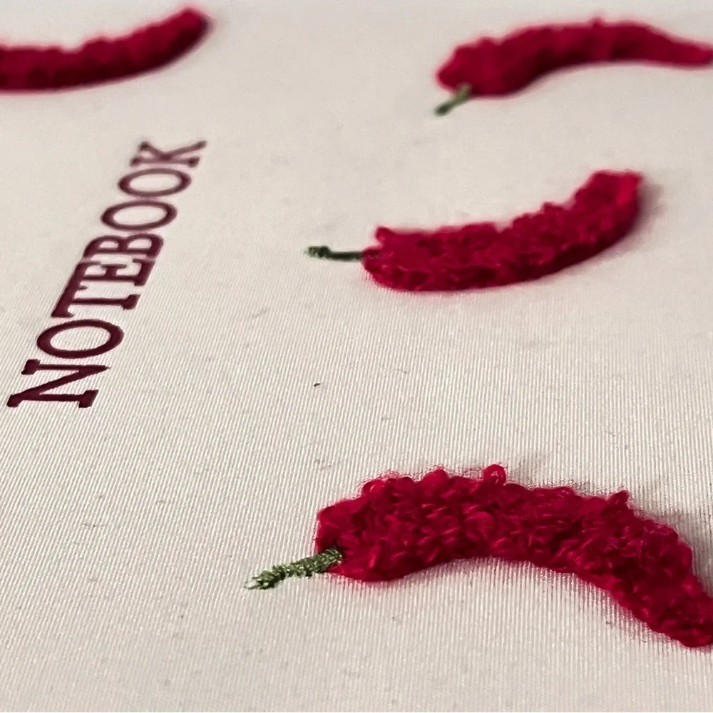 White Notebook with Red Chili Peppers
